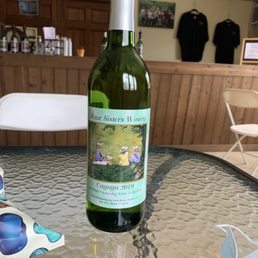 a bottle of wine on a table a bottle of wine on a table