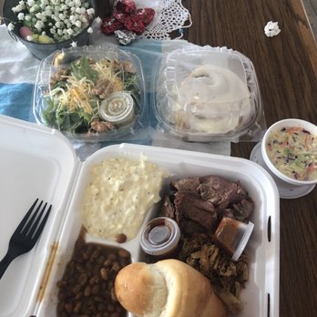 Juniper Cookhouse - Large platter with coleslaw, baked beans, cheesy potatoes, side salad, and cinnamon roll - Barbeque Near Me - Hines, Oregon