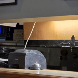 Frank's Pizza - A bell which doesn't look to clean to me.