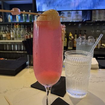 Linjee Thai - Bangkok 75: Gin, soho lychee, fresh lemon, dragonfruit, & champagne in a glass. - Thai Near Me - Alexandria, Virginia Linjee Thai - Bangkok 75: Gin, soho lychee, fresh lemon, dragonfruit, & champagne in a glass. - Thai Near Me - Alexandria, Virginia