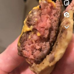 That's a cheeseburger served to my girlfriend from the back 4O. It's not med rare or the latter, it's raw in the middle. Just ghastly.