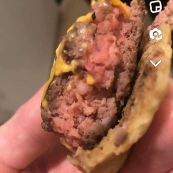 The Back 40 Taphouse Grill - That's a cheeseburger served to my girlfriend from the back 4O. It's not med rare or the latter, it's raw in the middle. Just ghastly. - American Near Me - Mitchell, South Dakota