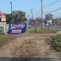 Trump Store - This is legal at 66607 Van Dyke, which looks like township property. These signs are ONLY posted on this fence on weekends. Can I post, too?