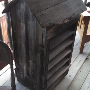 Rustic North - a wooden table and chair on a porch - General Contractors Near Me - Whitehorse, Yukon Rustic North - a wooden table and chair on a porch - General Contractors Near Me - Whitehorse, Yukon