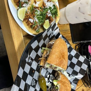 El Texano Tacos Y Mas - two tacoss on a table - Tacos Near Me - Irving, Texas