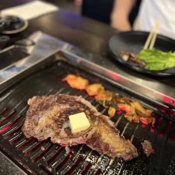 K-BBQ & Bar - steak with butter on the grill - Korean Near Me - Orlando, Florida