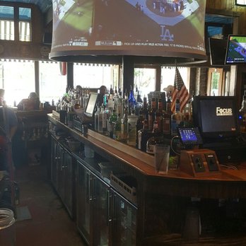 The Porch - a bar with people sitting at the bar - Sports Bars Near Me - San Marcos, Texas The Porch - a bar with people sitting at the bar - Sports Bars Near Me - San Marcos, Texas
