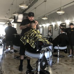 Braulio taking his time with my son's haircut. Braulio taking his time with my son's haircut.