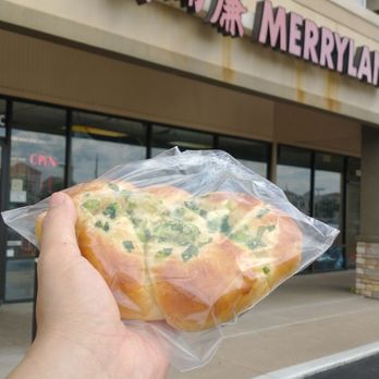 Merryland Bakery 美而廉 - hand holding a piece of bread - Bakeries Near Me - Houston, Texas