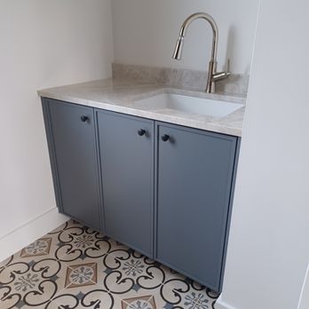 MM Home Solutions - a bathroom with a sink and cabinets - General Contractors Near Me