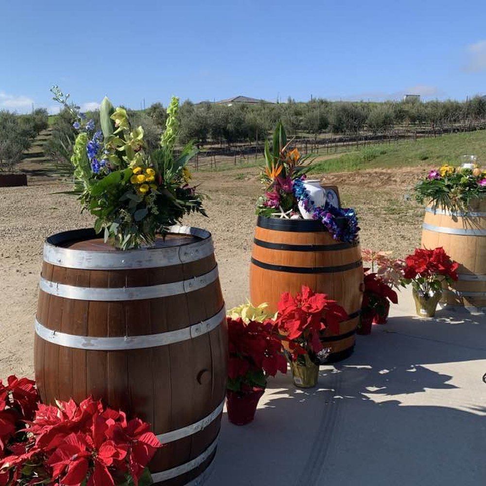 Country Florist - Flowers atop the barrels in the vineyard.  Does not do the flowers justice. - Florists Near Me - Paso Robles, California