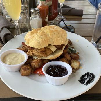 The Common Table - Fried Chicken Smothered Biscuit Sandwich - Breakfast & Brunch Near Me - Frisco, Texas The Common Table - Fried Chicken Smothered Biscuit Sandwich - Breakfast & Brunch Near Me - Frisco, Texas