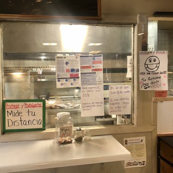 La Loncherita - Signs by the ordering window. - Mexican Near Me - Harvard, Illinois