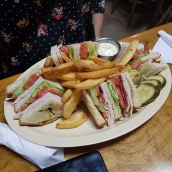 Mulberry Lane Cafe - This is the turkey club sandwich with fries. Looks like a lot of food. - Breakfast & Brunch Near Me - Melbourne, Florida