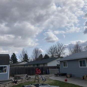 Workman Tree and Landscaping - a man using a chainsaw to trim a tree - Landscaping Near Me Workman Tree and Landscaping - a man using a chainsaw to trim a tree - Landscaping Near Me