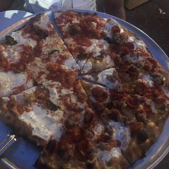 Juliana's - Margherita pizza. Half regular, half with added pepperoni and sausage. - Pizza Near Me - Brooklyn, New York