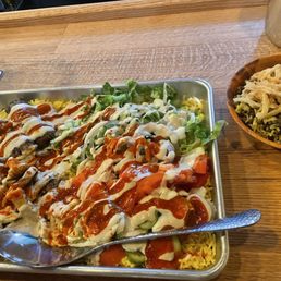 Family plate for 2. Beef kofta, chicken shawarma and veggies, sauces on rice. Mejadra side. Family plate for 2. Beef kofta, chicken shawarma and veggies, sauces on rice. Mejadra side.