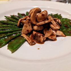 Bunha Faun - Snow pea and mushroom salad in a sesame dressing.