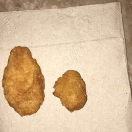 two fried chicken nuggies on a napkin two fried chicken nuggies on a napkin