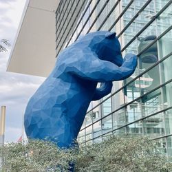 Big blue bear looking into the convention center