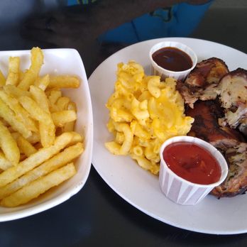 Clive's Cafe - Jerk chicken with mac and cheese and fries. - Caribbean Near Me - Miami, Florida