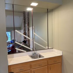 Harvey Aingworth Acoustic Ceilings - Remove existing square recessed light, remove mirrors and brackets.