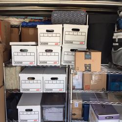 Grade A Moving & Storage - Loading boxes onto rack customer ask not to take down racks so we made it work