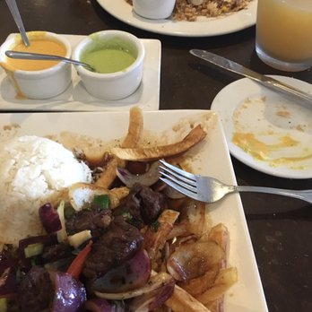 El Rocoto - Lomo saltado and far away there is chaufa de mariscos (seafood fried rice) - Peruvian Near Me - Gardena, California El Rocoto - Lomo saltado and far away there is chaufa de mariscos (seafood fried rice) - Peruvian Near Me - Gardena, California
