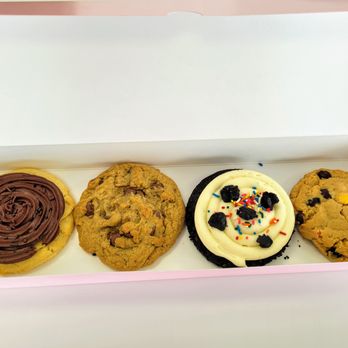 Crumbl - Covington - Left to right: Chocolate Cake, Chocolate Chip, Birthday Cake Oreo, Reese's Peanut Butter - Bakeries Near Me - Covington, Washington Crumbl - Covington - Left to right: Chocolate Cake, Chocolate Chip, Birthday Cake Oreo, Reese's Peanut Butter - Bakeries Near Me - Covington, Washington