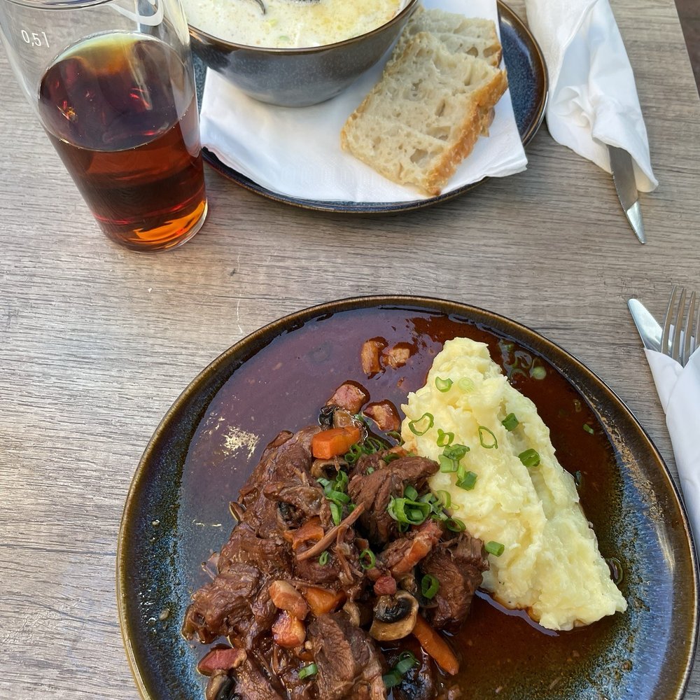Fish soup with bread and beef bourguignon with mashed potatoes