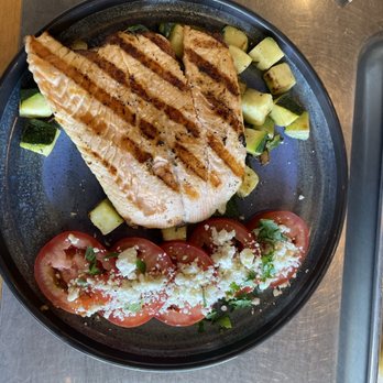 California Fish Grill - Grilled salmon, tomatoes with feta, rosemary zucchini - Seafood Near Me - Thousand Oaks, California