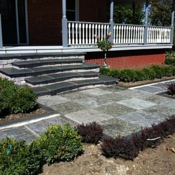 Meyer's Landscaping - a patio with steps leading up to a house - Landscaping Near Me - Peterborough, Ontario Meyer's Landscaping - a patio with steps leading up to a house - Landscaping Near Me - Peterborough, Ontario