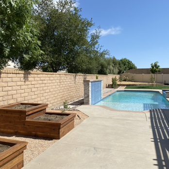 Pitkin Landscape & Design - Custom redwood planter boxes and customer poured pavers around pool. - Landscaping Near Me Pitkin Landscape & Design - Custom redwood planter boxes and customer poured pavers around pool. - Landscaping Near Me