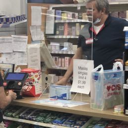 Cashier without a mask on