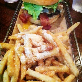 Hops Burger Bar - The whole meal: North Carolinian burger, truffle oil + parmesan fries, & a dill pickle - Burgers Near Me - Greensboro, North Carolina