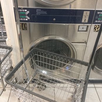 Won Jo Lee - Laundry basket in front of washer - Laundromat Near Me - Atlanta, Georgia Won Jo Lee - Laundry basket in front of washer - Laundromat Near Me - Atlanta, Georgia