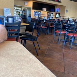 tables and chairs in a restaurant tables and chairs in a restaurant