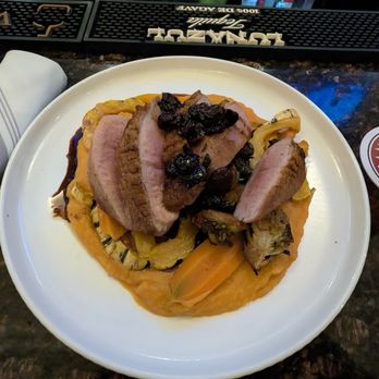 The Library Wine Bar & Bistro - Duck Breast w/ pickled baby carrots, honey garlic roasted brussels sprouts, roasted delicata squash, sweet potato puree, amarena cherry sauc - Wine Bars Near Me - Wallingford, Connecticut The Library Wine Bar & Bistro - Duck Breast w/ pickled baby carrots, honey garlic roasted brussels sprouts, roasted delicata squash, sweet potato puree, amarena cherry sauc - Wine Bars Near Me - Wallingford, Connecticut