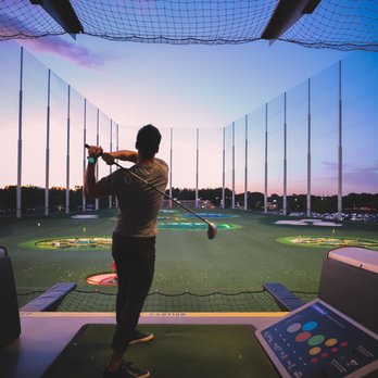 Topgolf - Golf Holes light up at night with the beautiful sunset in back! - New American Near Me - Brooklyn Center, Minnesota Topgolf - Golf Holes light up at night with the beautiful sunset in back! - New American Near Me - Brooklyn Center, Minnesota