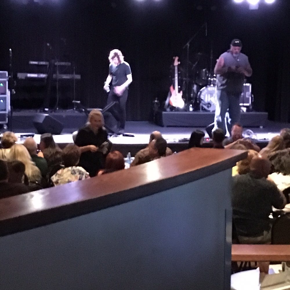 a band performing on stage a band performing on stage