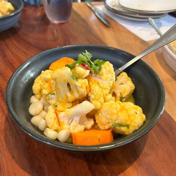 Limón - Flor del huerto - cauliflower, vegan ají amarillo leche de tigre, sweet potato, red onions, and choclo - Peruvian Near Me - Oakland, California