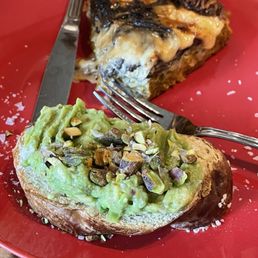 Mushroom spinach quiche with Avocado Mash on pretzel bread Mushroom spinach quiche with Avocado Mash on pretzel bread