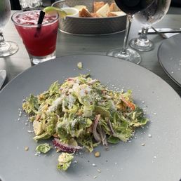 SPROUTS SALAD, purple haze cocktail, and a glass of Montepulciano SPROUTS SALAD, purple haze cocktail, and a glass of Montepulciano