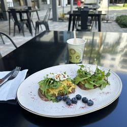 Kobs Green Market - Avocado toast with arugula and eggs topped with cottage cheese