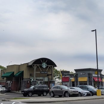 Starbucks - cars parked in front of a starbucks coffee shop - Coffee & Tea Near Me - Calgary, Alberta Starbucks - cars parked in front of a starbucks coffee shop - Coffee & Tea Near Me - Calgary, Alberta