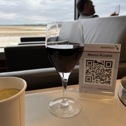 a glass of wine and a qr code a glass of wine and a qr code