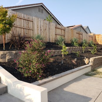 Ryan Rouse Designs - Ryan's team worked very hard build this retaining wall with minimal electrical equipment due to lack of access to the backyard. - Landscaping Near Me Ryan Rouse Designs - Ryan's team worked very hard build this retaining wall with minimal electrical equipment due to lack of access to the backyard. - Landscaping Near Me