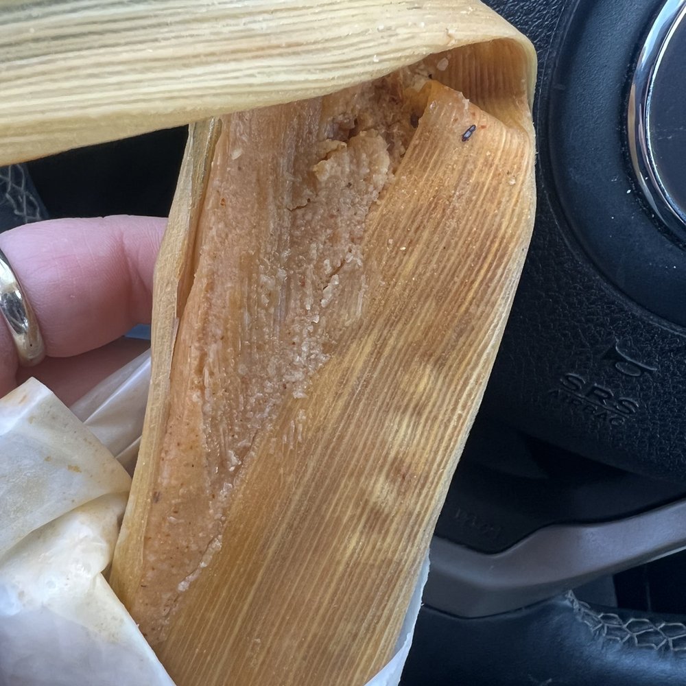 Tamale Kitchen - You can see the bug in the top left corner and it's antennas on the wrapper - Mexican Near Me - Northglenn, Colorado