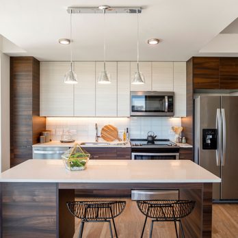 The Witmer - Darkwood cabinets and white granite on stainless steel - Apartments Near Me - Arlington, Virginia The Witmer - Darkwood cabinets and white granite on stainless steel - Apartments Near Me - Arlington, Virginia