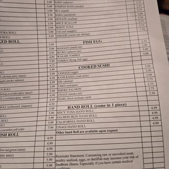 Sushi Bar - The menu features sections for sushi or sashimi, raw fish, fish eggs, cooked sushi, and hand rolls, with prices listed for each item. - Japanese Near Me - Bloomington, Indiana